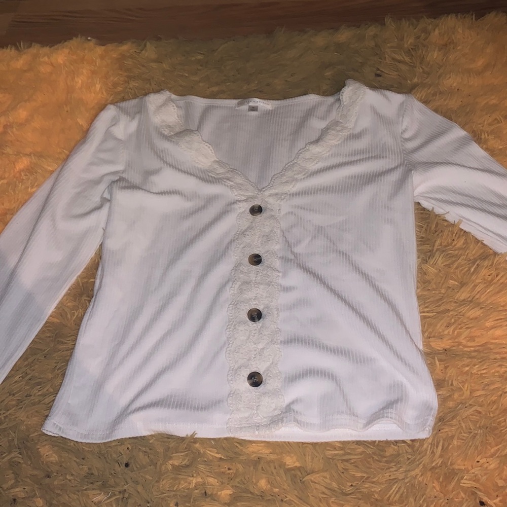 Literally new! It is cropped. Cute lace detail with fake buttons.